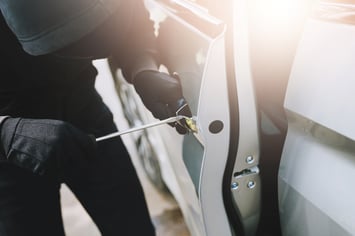 Man breaking into car